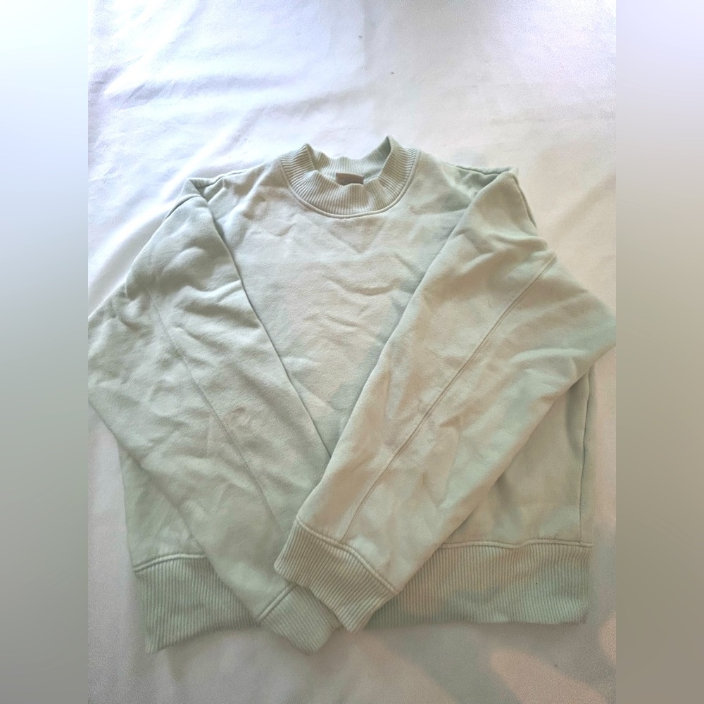 A new day, bluish green almost light teal, scoop neck sweater.